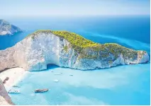  ?? PHOTOS: GETTY IMAGES/ISTOCKPHOT­O ?? The waters are a pristine neon blue at Shipwreck Beach on the Ionian island of Zakynthos.