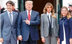  ?? AP ?? President Donald Trump and first lady Melania Trump welcome Canadian Prime Minister Justin Trudeau and his wife Sophie Gregoire Trudeau to the White House in Washington, on Thursday. —