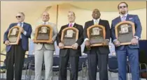  ?? HANS PENNINK, THE ASSOCIATED PRESS ?? From left, Hall of Famers Bud Selig, Ivan Rodriguez, John Schuerholz, Tim Raines Sr. and Jeff Bagwell hold up their plaques Sunday.