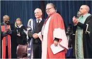  ??  ?? Professor Robert Hill (second right) shake hands with University of Toronto President, Prof Meric S. Gertler, as Columbia University Professor David Scott (left) and Professor Ira Jacobs (right) applaud, in Toronto, Canada, recently.