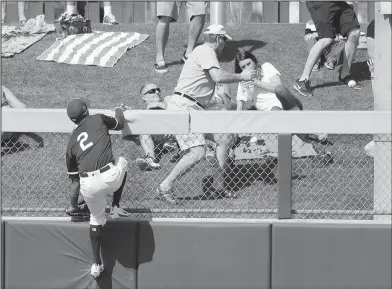  ?? Associated Press ?? It's gone: Oakland's Khris Davis watches a three-run home run by Cleveland's Erik Gonzalez during the third inning of their spring training game on Saturday in Mesa, Ariz.