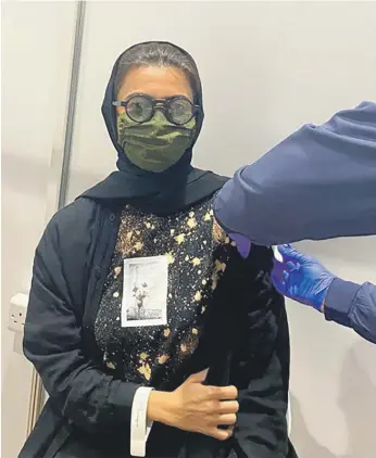  ?? Instagram ?? Minister of Culture and Youth Noura Al Kaabi receives the Covid-19 vaccine yesterday. The vaccine was developed by Sinopharm and is undergoing Phase-3 trials in the UAE