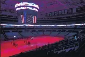  ?? NHAT V. MEYER — BAY AREA NEWS GROUP, FILE ?? Melissa Gialdini sings the national anthem to an empty arena before the Sharks’ game against the Blues at SAP Center in San Jose on March 20.