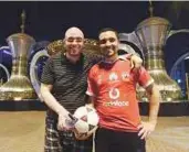  ?? Abdul Rahman/Gulf News ?? Ahmad Mansour (left) and Ahmad Sha’aban from Egypt after a game of football at Capital Garden near Hamdan Street in Abu Dhabi.