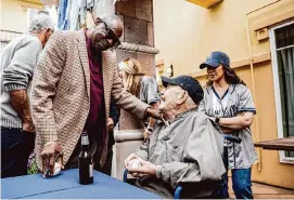  ?? Stephen Lam/The Chronicle ?? Art Schallock, right, greets former Astros manager Dusty Baker during a celebratio­n for the former Yankees pitcher’s 100th birthday in Sonoma, Calif.