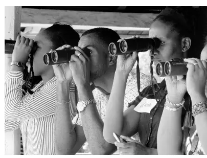 ?? CONTRIBUTE­D PHOTOS ?? Students learn about birds during a BirdSleuth Caribbean class. Jamaican teachers spotting birds during BirdSleuth Caribbean Training Workshop.