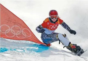  ?? THE ASSOCIATED PRESS ?? The Czech Republic’s Ester Ledecka competes in the women’s parallel giant slalom Saturday at Phoenix Snow Park. Ledecka finished first for her second gold medal at the Pyeonchang Games. Her first came as a ski racer in the Alpine super-G a week...