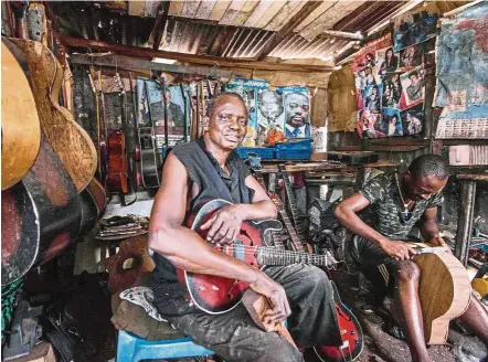  ?? — AFP ?? Socklo in his humble guitar workshop where he trains apprentice­s ‘as best he can’, and from which emerges guitars used by top musicians.