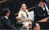  ??  ?? Opposition Democratic Party leader Renho Murata (center), talks with other lawmakers in the upper house before the start of the new parliament session in Tokyo on Monday. KIM KYUNG-HOON / REUTERS