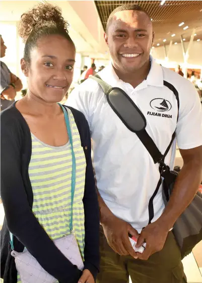  ?? Photo: Waisea Nasokia ?? Fiji Airways Drua winger Avete Daveta with a fan, Milly Volavola, at the Nadi Internatio­nal Airport on September 26, 2017.