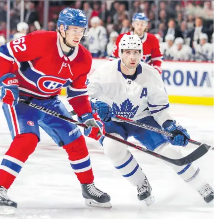  ?? JOHN MAHONEY ?? Montreal Canadiens forward Artturi Lehkonen covers Toronto Maple Leafs centre John Tavares during NHL pre-season action in Montreal earlier this week. Lehkonen is one of four players born in Finland who could be playing with the Canadiens this season.