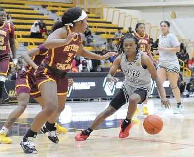  ?? (Special to the Commercial/William Harvey) ?? UAPB guard Kaila Walker (25) is guarded by Bethune-Cookman guard Karianna Woods (3) during Monday night’s women’s basketball game at H.O. Clemmons Arena in Pine Bluff.