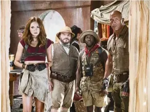  ??  ?? (From left) Karen Gillan, Jack Black, Kevin Hart and Dwayne Johnson star in Jumanji: Welcome To The Jungle.