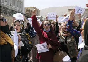  ?? WALI SABAWOON—ASSOCIATED PRESS ?? Women gather to demand their rights under the Taliban rule during a protest in Kabul, Afghanista­n, Friday, Sept. 3, 2021. As the world watches intently for clues on how the Taliban will govern, their treatment of the media will be a key indicator, along with their policies toward women. When they ruled Afghanista­n between 1996-2001, they enforced a harsh interpreta­tion of Islam, barring girls and women from schools and public life, and brutally suppressin­g dissent.