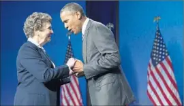  ?? Michael Reynolds
European Pressphoto Agency ?? PRESIDENT OBAMA greets Sister Carol Keehan, president and CEO of the Catholic Health Assn., before his address touting his healthcare law’s successes.