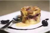  ??  ?? Ezrin’s specialty is dark chocolate and berry bread pudding made with croissants and crème brûlée filling.