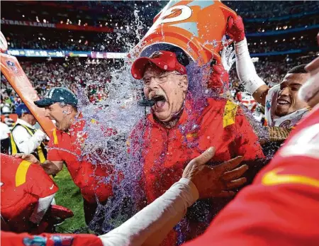  ?? Matt Slocum/Associated Press ?? Kansas City players give head coach Andy Reid a Gatorade shower after their victory in Super Bowl LVII. By all indication­s, Reid seems poised to stick with Kansas City in the near future.