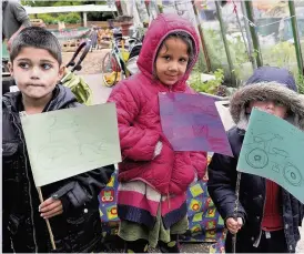  ??  ?? FLYING THE FLAG: Children join in a protest against a third runway at HeathrowPh­oto by Katie Lamb www.buyaphotot­ms.co.uk WL153386