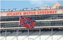  ?? HAGY/USA TODAY SPORTS ADAM ?? A Confederat­e flag is seen in the infield prior to qualifying for the Folds of Honor QuikTrip 500 in 2018 at Atlanta Motor Speedway.