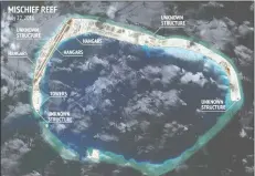  ?? (CSIS/AMTI and DigitalGlo­be photo) ?? This is an aerial photograph of Panganiban Reef (Mischief Reef), where China has built a weather station.