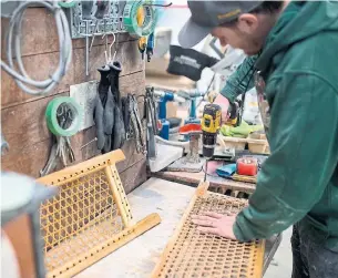  ?? JAMES MACDONALD BLOOMBERG ?? A worker makes a seat for a canoe at the Holy Cow Canoe Co. in Guelph. Despite positive employment gains, the Bank of Canada has reported a “puzzling” stretch of weak wage growth.