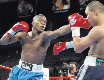  ?? Laura Rauch ?? The Associated Press Floyd Mayweather lands a left to Jose Luis Castillo during their WBC lightweigh­t fight in 2002 at Mandalay Bay Events Center.