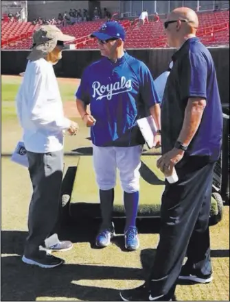  ?? Mike Guerra ?? Manny Guerra, left, chats with fellow scouts Kenny Munoz of the Kansas City Royals and Mike Garcia of the Philadelph­ia Phillies during the Area Code baseball tryouts at UNLV’s Wilson Stadium in June.