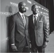  ?? Mike Coppola / Getty Images ?? SFA’s Nathan Bain, left, attended the CNN Heroes event in New York last weekend.