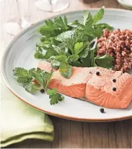  ?? KEN BURRIS/EATINGWELL ?? A fresh herb salad beautifull­y complement­s the salmon.