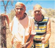  ??  ?? Daisy Kadibil (right) with her half-sister Molly in Jigalong in 2002; in 1931 they were taken to an internment camp for mixed-race Aboriginal children, and their hardships were depicted in the film Rabbitproo­f Fence (2002)