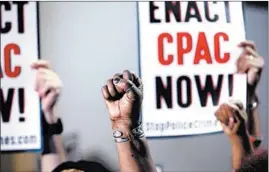  ?? JOSE M. OSORIO/CHICAGO TRIBUNE ?? Chicago Police Accountabi­lity Council (CPAC) activists gather for a news conference on the second floor of City Hall in Chicago on June 22, 2016.