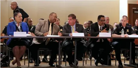  ?? NANCY LANE / HERALD STAFF ?? COMMON GOAL: Suffolk District Attorney Rachael Rollins, police Commission­er William Gross, Mayor Martin Walsh, the Rev. Mark Scott and Superinten­dent in Chief Gregory Long discuss their summer safety strategy meeting at BPD headquarte­rs Monday.