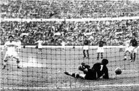  ??  ?? Ferenc Puskás (left) scores the opening goal in Hungary’s 2-0 win over Yugoslavia in the gold medal match at the Helsinki Olympics in August 1952. Zoltán Czibor scored the other goal at the Olympic Stadium, Helsinki in front of 58,553 fans. Photograph: EPA