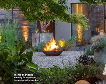  ??  ?? The fire pit creates a warming focal point for the garden in the evenings