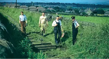  ?? R K WALTON ?? A Yorkshire-area working party lifting the rails at Crich circa 1958, which were moved to Tywyn.