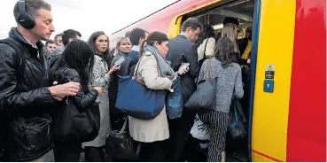  ??  ?? Passengers trying to cram on to a South Western service, which will be hit again by strike action