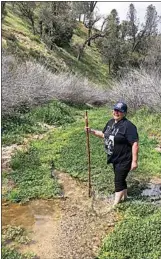  ?? JON HAMMOND / FOR TEHACHAPI NEWS ?? Merlene Everson crosses a creek in Loraine near the former site of a cabin where her mother lived as a child.
