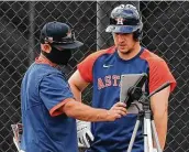  ?? Karen Warren / Staff photograph­er ?? Third baseman Alex Bregman, right, is one of the Astros’ main proponents of using video.