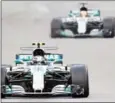  ?? GIUSEPPE CACACE/AFP ?? Mercedes’ Finnish driver Valtteri Bottas steers his car followed by Mercedes’ British driver Lewis Hamilton during the Abu Dhabi Formula One Grand Prix on Sunday.