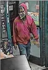  ?? CONTRIBUTE­D ?? A man with a gun enters a Delray Beach gas station. Sheriff’s Office investigat­ors believe it is Damion Delapena.