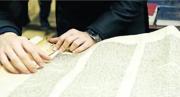  ??  ?? When the Sons of Israel Synagogue in Glace Bay, N.S., closed in 2010, its Torah scrolls, which are handwritte­n on parchment and weigh as much as 20 kilograms each, were put into storage. Now members are looking to give away the last of them, but want...