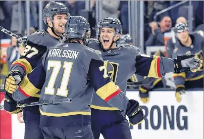  ?? AP PHOTO ?? Vegas Golden Knights’ Shea Theodore (27), William Karlsson (71) and Jonathan Marchessau­lt celebrate Karlsson’s goal against the Edmonton Oilers during the second period of an NHL game Saturday in Las Vegas.