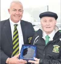  ?? (Pic: John Ahern) ?? HONOURING TED: Ted ‘Tadie’ O’Connor, Park Utd groundsman for over 30 years, accepting a special achievemen­t award by chairman, Sean Keane, at the official opening of the club’s new all weather facility and walkway in Brigown Park last August.