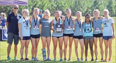  ?? Courtesy, Dalton State Athletics ?? The Dalton State women’s cross country team, featuring Heritage High alum Alex Gass (fourth from right), won their season-opening event at Middle Georgia College in Macon on Saturday.