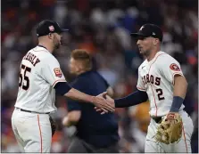  ?? DAVID J. PHILLIP – THE ASSOCIATED PRESS ?? Astros closer Ryan Pressly, left, gets a handshake from third baseman Alex Bregman after recording the final out against the Yankees on Thursday.