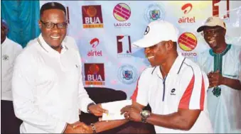  ??  ?? Governor of Kwara State, Abdulfatah Ahmed (left), presenting an award to the winner of the Senior Tour of the PGA of Nigeria, Eric Ozuzu… recently