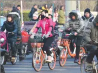  ?? PROVIDED TO CHINA DAILY ?? Bike-sharing apps have exploded in China in recent years, with increasing numbers of Chinese traveling to work on two wheels.