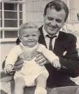  ??  ?? Doting dad: Frank Debell with his baby son Simon