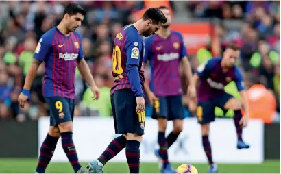  ?? AP ?? Barcelona’s Messi reacts after Betis scored their side’s second goal during the Spanish La Liga match at the Camp Nou stadium. —