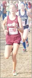  ?? Graham Thomas/Siloam Sunday ?? Siloam Springs sophomore Chloe Maxwell finished seventh overall and was the top finisher for the Lady Panthers Friday in the Class 6A State Championsh­ip Cross Country Meet at Oaklawn Park in Hot Springs.